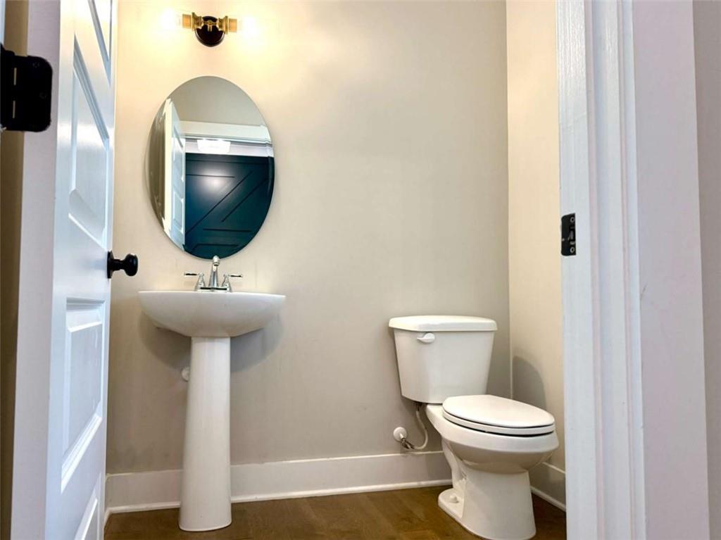 2362 Browns Mill Road Southeast Atlanta, GA 30315 - Photo 16 of 41 a bathroom with a sink toilet and mirror