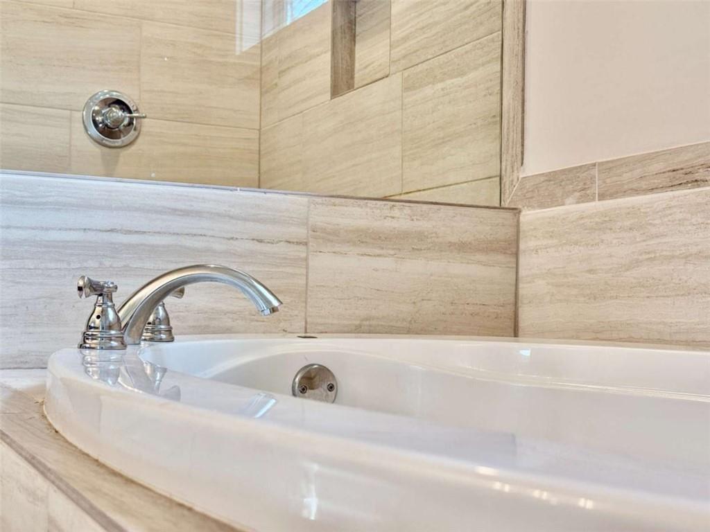 2362 Browns Mill Road Southeast Atlanta, GA 30315 - Photo 24 of 41 a bathroom with a sink and mirror