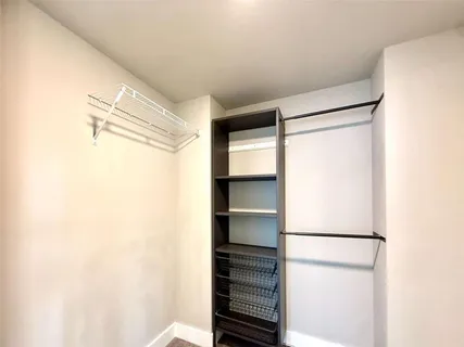 a bathroom with a granite countertop sink toilet a large mirror a bathtub and shower