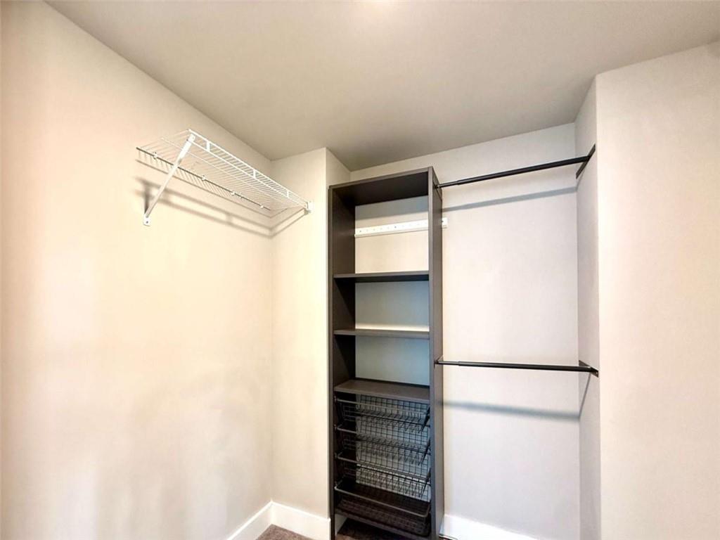 2362 Browns Mill Road Southeast Atlanta, GA 30315 - Photo 27 of 41 a view of walk in closet with empty racks