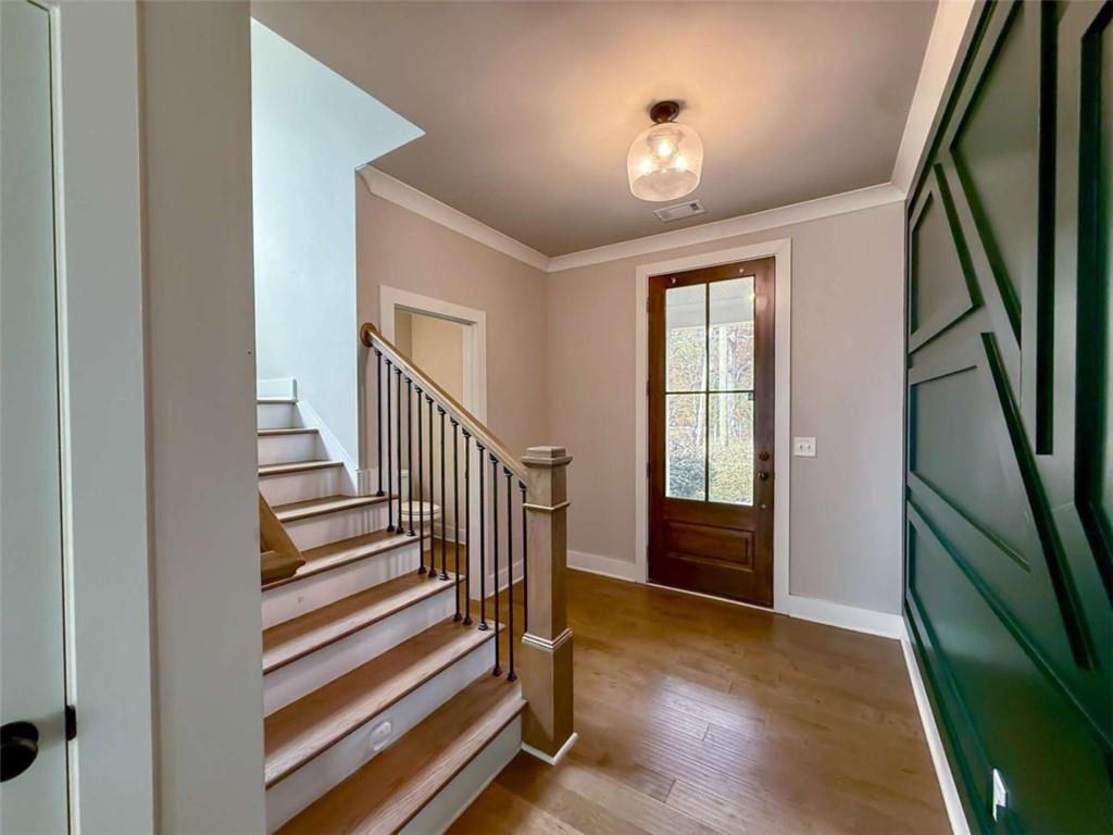 2362 Browns Mill Road Southeast Atlanta, GA 30315 - Photo 3 of 41 a view of entryway with stairs and wooden floor