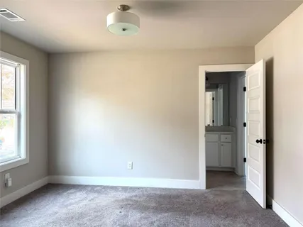 a view of a room with a dresser and couch