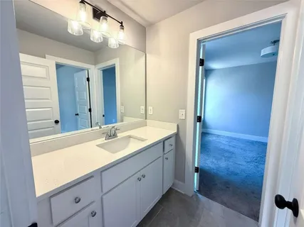 an empty room with closet and wooden door