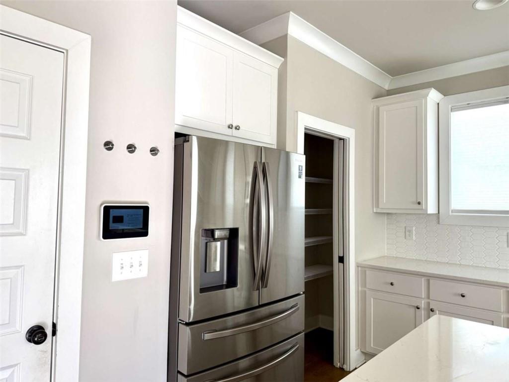 2362 Browns Mill Road Southeast Atlanta, GA 30315 - Photo 9 of 41 a kitchen with stainless steel appliances and refrigerator