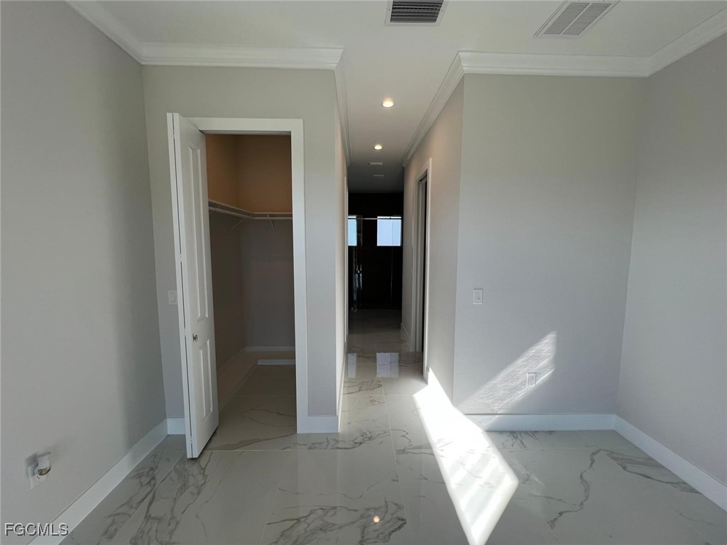 3672 68th Avenue Northeast Naples, FL 34120 - Photo 14 of 18 a view of a hallway with an entryway