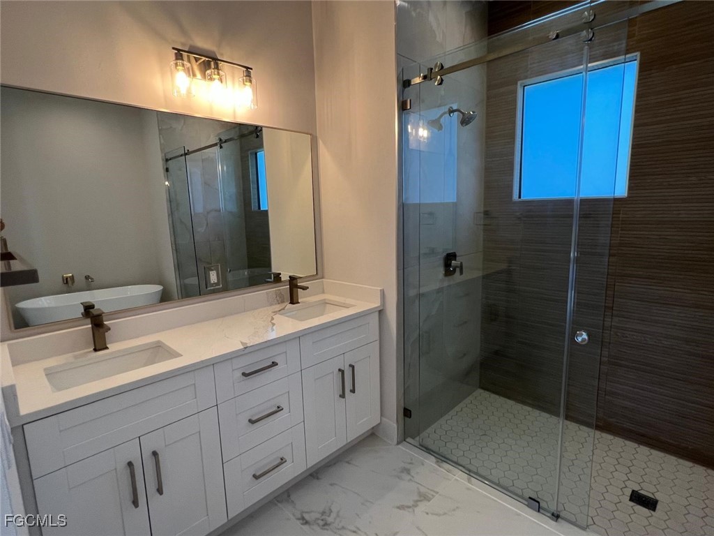 3672 68th Avenue Northeast Naples, FL 34120 - Photo 15 of 18 a bathroom with double sink and a mirror