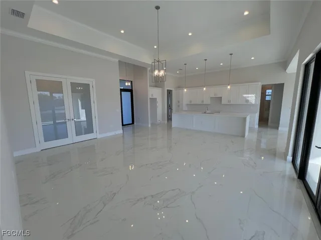 a view of a hallway with chandelier
