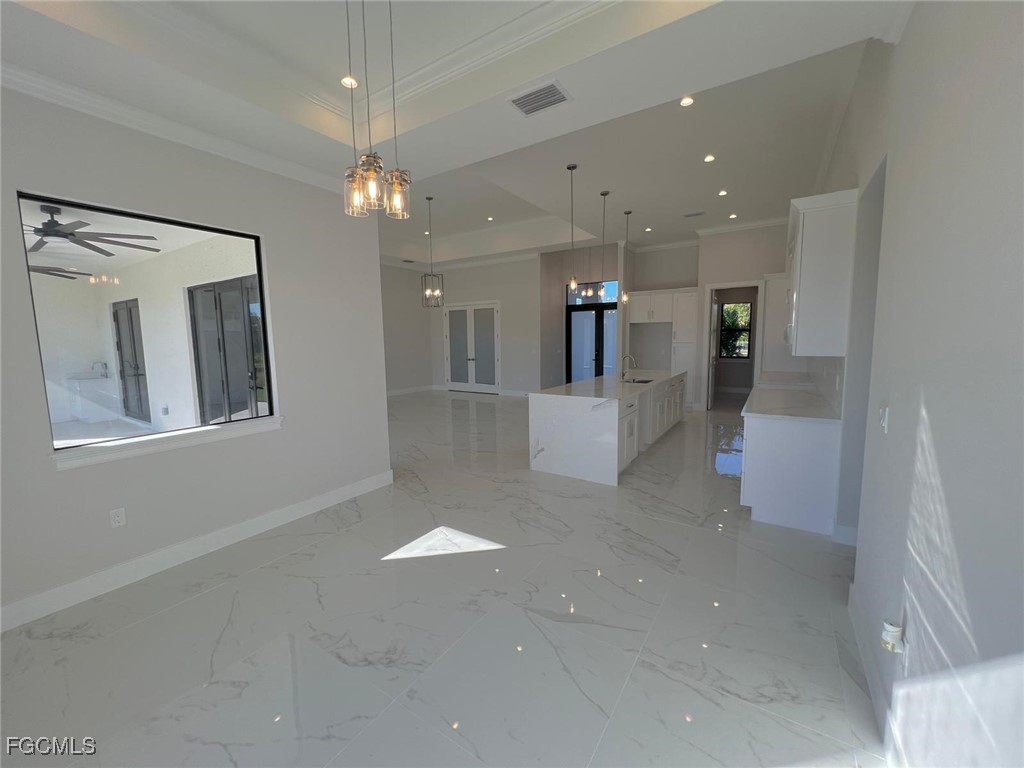 3672 68th Avenue Northeast Naples, FL 34120 - Photo 6 of 18 a view of a hallway with chandelier
