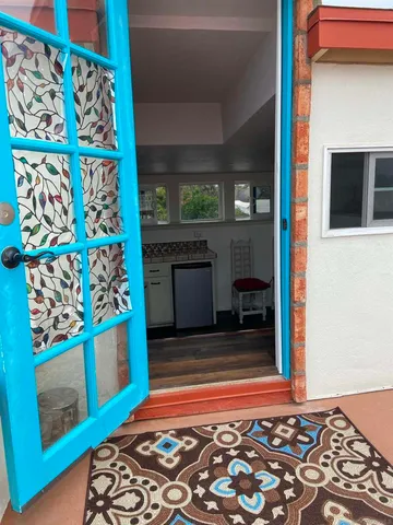 a view of empty room with window and fireplace