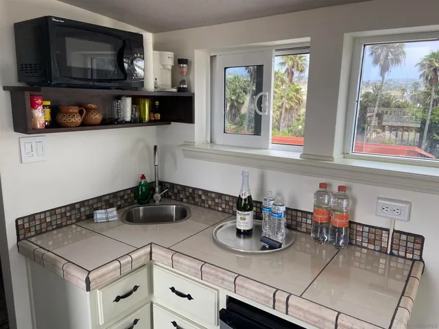 a kitchen with a stove and a microwave