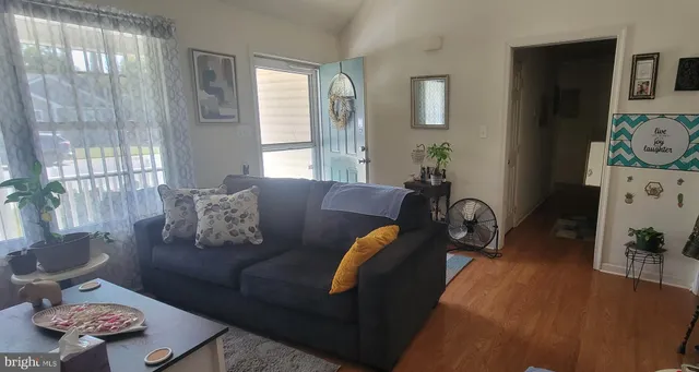 a living room with furniture and a table