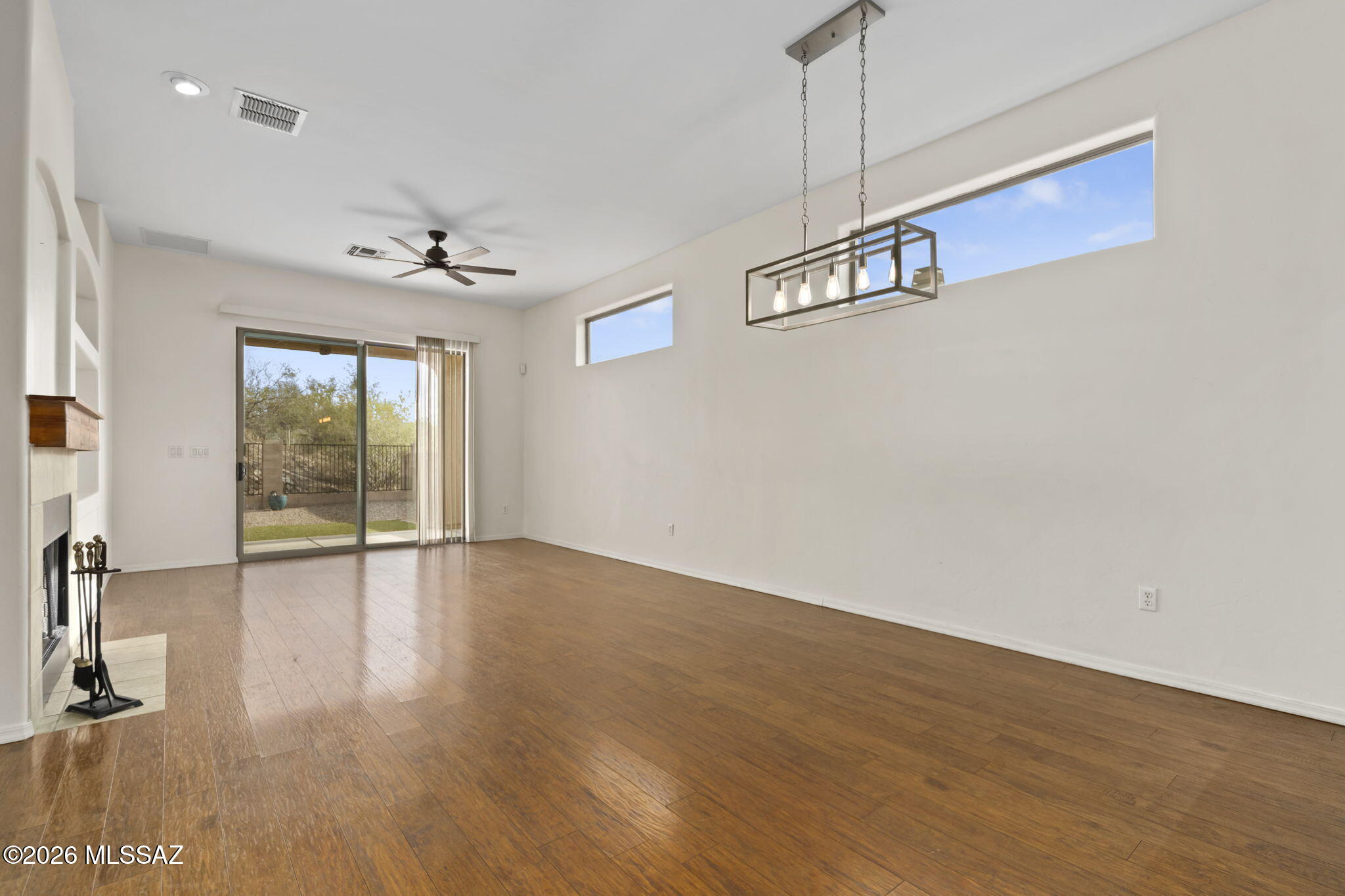 13668 East High Plains Ranch Street Vail, AZ 85641 - Photo 15 of 51 a view of a livingroom with wooden floor and a window