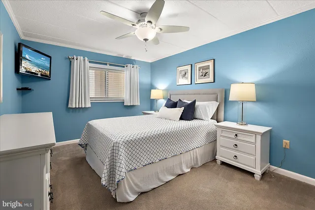 a bedroom with a bed and a night stand