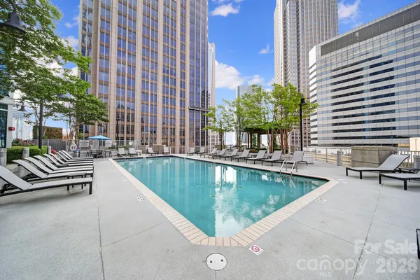 a view of swimming pool with outdoor seating