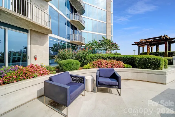 a wooden bench sitting in front of a building