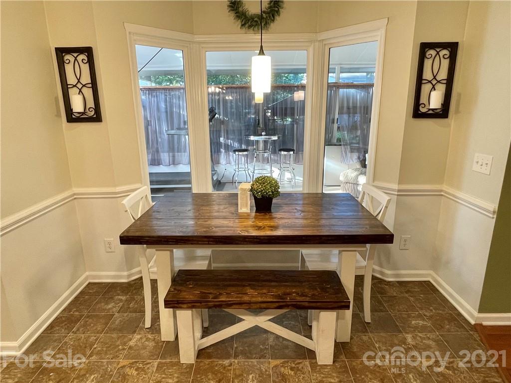6607 Reedy Creek Road Charlotte, NC 28215 - Photo 13 of 27 a dining room with table and chair