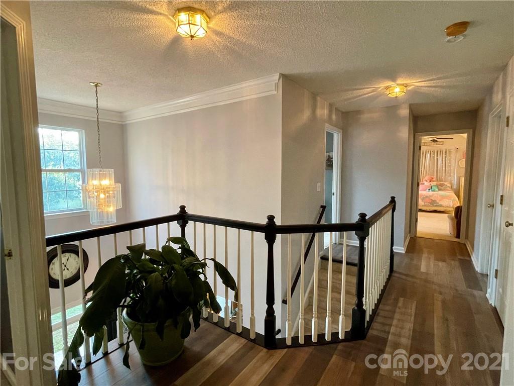 6607 Reedy Creek Road Charlotte, NC 28215 - Photo 16 of 27 a view of entryway with wooden floor