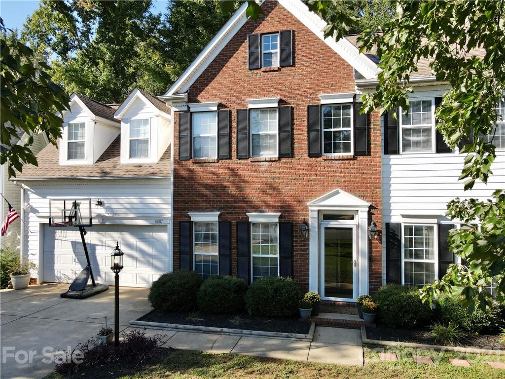 6607 Reedy Creek Road Charlotte, NC 28215 - Photo 4 of 27 a front view of a house with garden