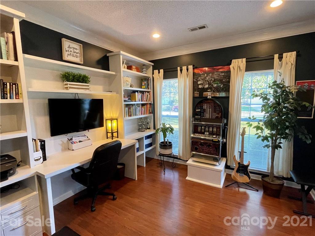 6607 Reedy Creek Road Charlotte, NC 28215 - Photo 6 of 27 a livingroom with workspace window and a couch
