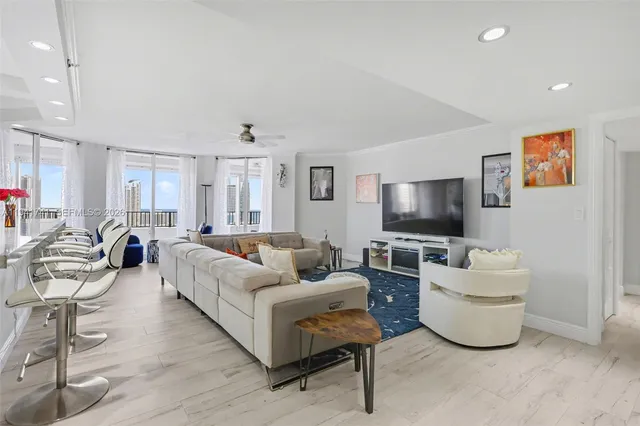 a bed sitting in a bedroom and chair