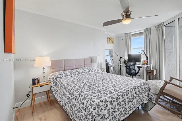 a bedroom with a bed and a television