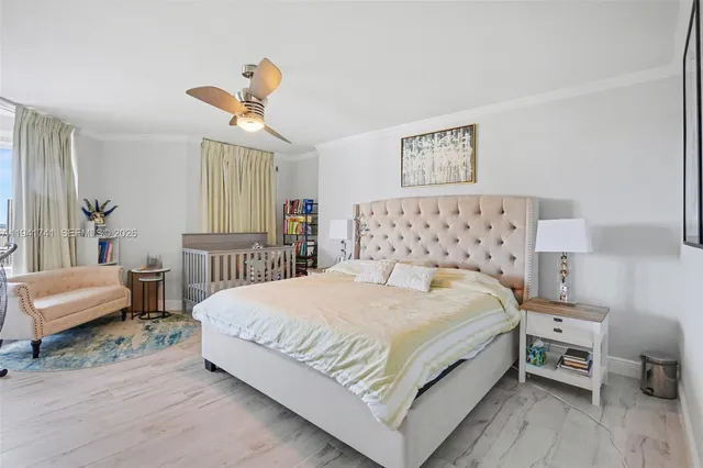 a bed room with a bed and a chandelier