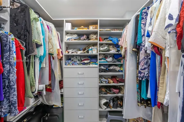 a view of staircase with white walls and windows