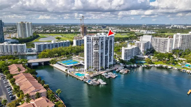 a view of a lake with tall buildings