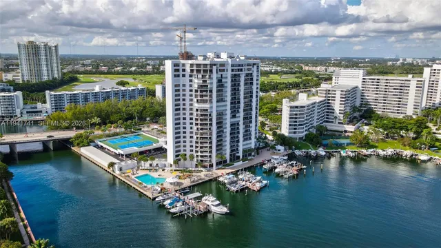 a aerial view of a house with a swimming pool patio and outdoor seating