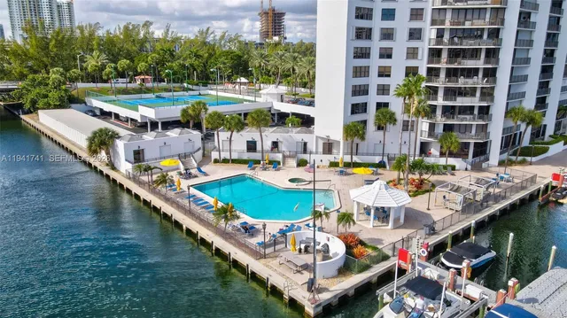 a view of a lake with tall buildings