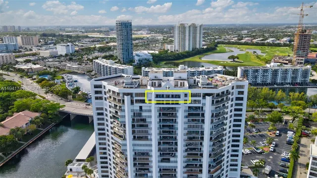an aerial view of a house with outdoor seating