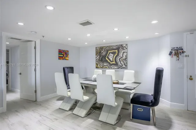 a utility room with sink dryer and washer
