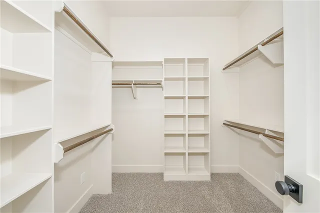 a bathroom with a double vanity sink and mirror