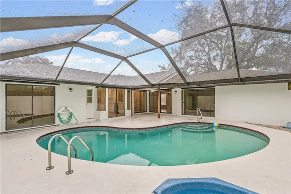 a view of a swimming pool with a patio