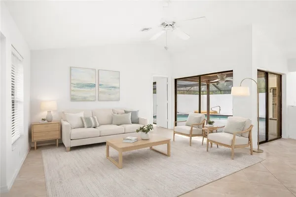 a living room with furniture and a large window
