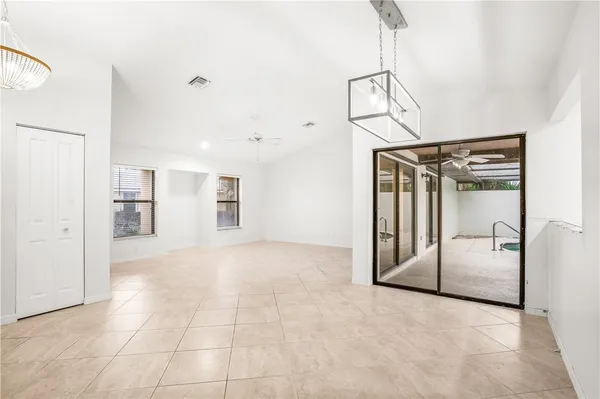 a view of a hallway with a chandelier
