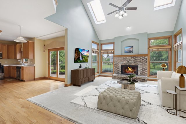 548 Asbury Drive Aurora, IL 60502 - Photo 20 of 48 a living room with furniture and a fireplace