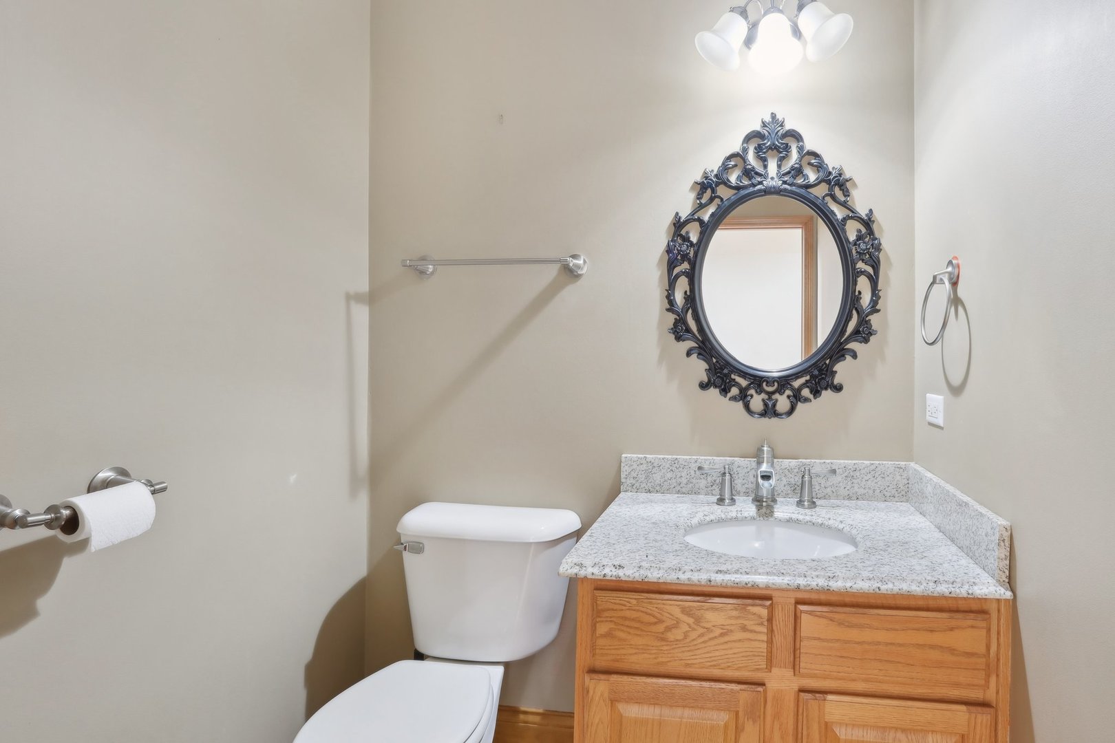 548 Asbury Drive Aurora, IL 60502 - Photo 22 of 48 a bathroom with a granite countertop toilet sink and mirror
