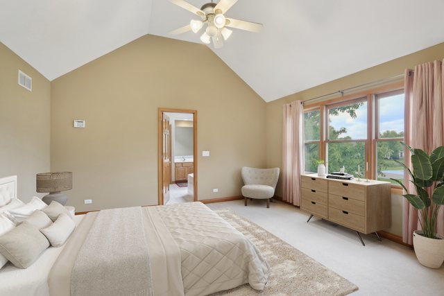 548 Asbury Drive Aurora, IL 60502 - Photo 24 of 48 a bedroom with a bed couch and large windows