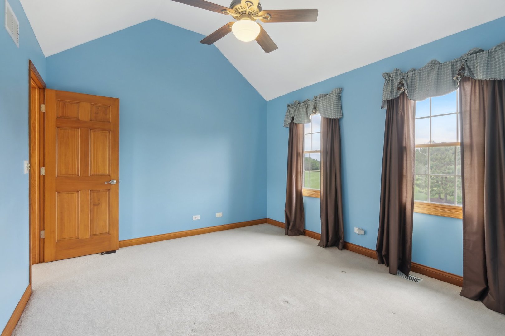 548 Asbury Drive Aurora, IL 60502 - Photo 30 of 48 an empty room with chandelier fan and windows
