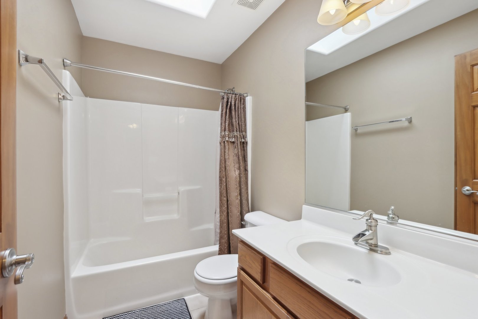 548 Asbury Drive Aurora, IL 60502 - Photo 37 of 48 a bathroom with a sink toilet and shower