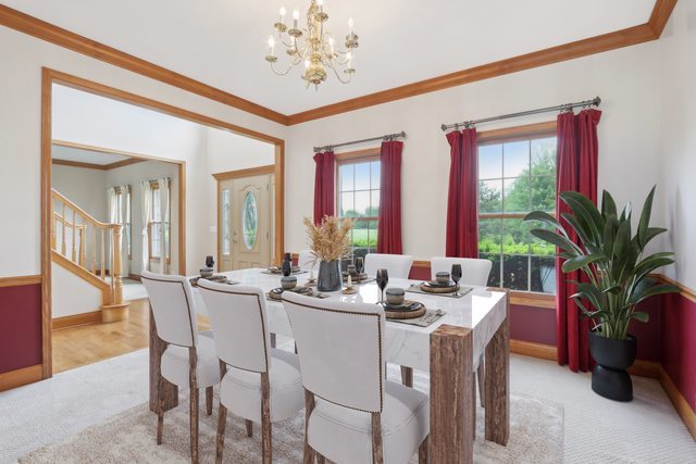 548 Asbury Drive Aurora, IL 60502 - Photo 9 of 48 a view of a dining room with furniture window and wooden floor