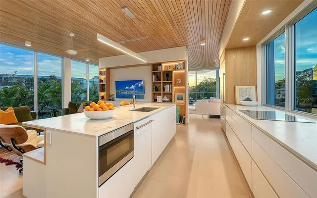 a view of a room with wooden floor and windows