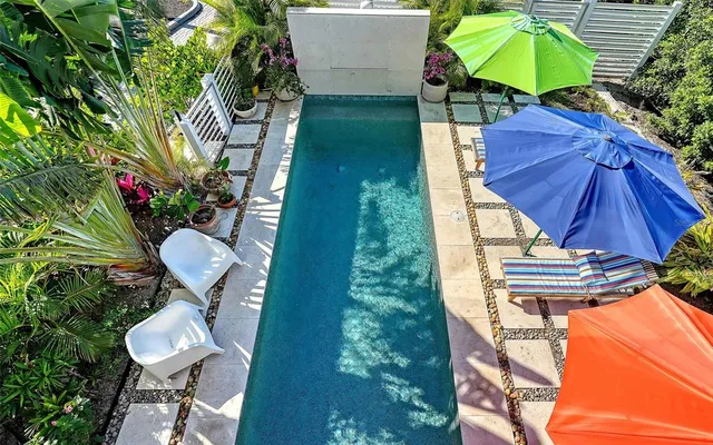 a bedroom with a large bed and a yard with potted plant