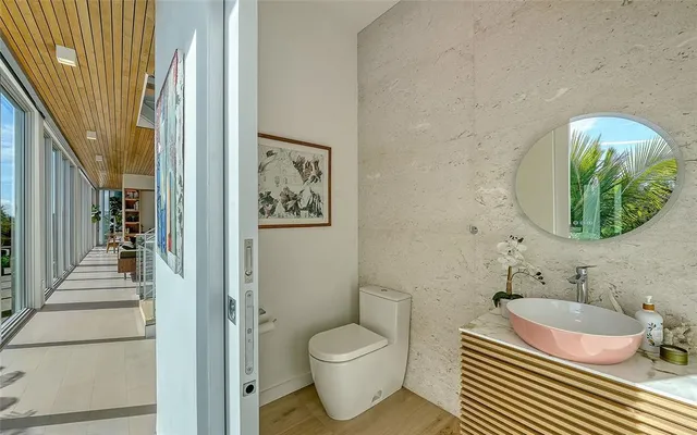 a view of a chairs and table in the balcony