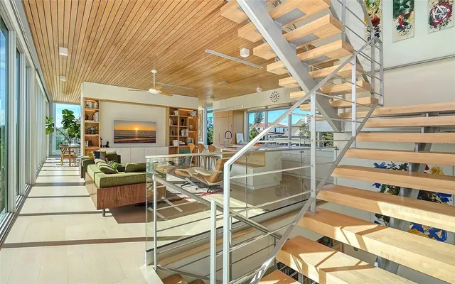 a bathroom with a granite countertop sink a toilet and shower