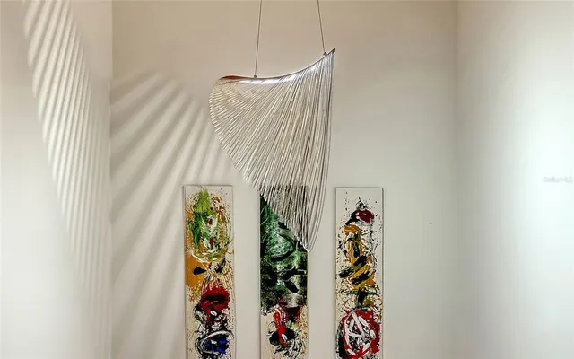 a view of staircase with white walls and a window