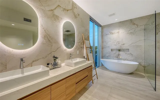 an aerial view of a house with swimming pool and a yard