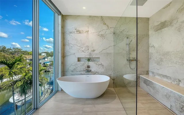an aerial view of house with yard swimming pool and outdoor seating