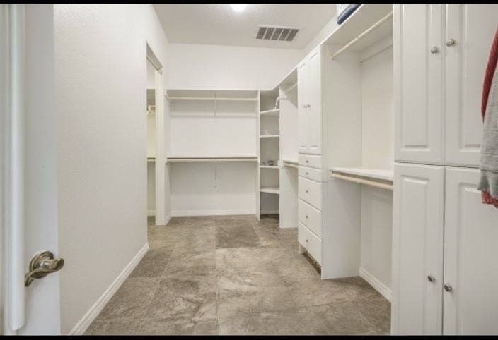 20547 Crosby Eastgate Road Crosby, TX 77532 - Photo 14 of 44 It takes two photos to see the entire primary closet.